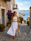 Woman wearing a white cotton pleated maxi skirt