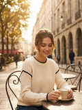 Woman wearing a cream contrast-trim textured knit top