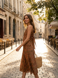 Woman wearing a printed sleeveless tie-back skirt set
