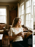 Woman wearing a V-neck scalloped-hem knit top
