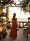 Woman wearing a solid backless maxi dress