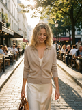 Woman wearing an open-collar button-up knit sweater