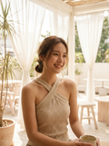 Woman wearing a cotton-linen crisscross halter tank top