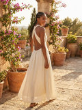 Woman wearing an open-back sleeveless maxi dress
