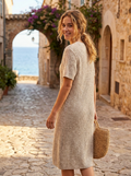 Woman wearing a short-sleeve textured knit midi dress