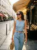 Woman wearing a crop denim top and pleated pants set
