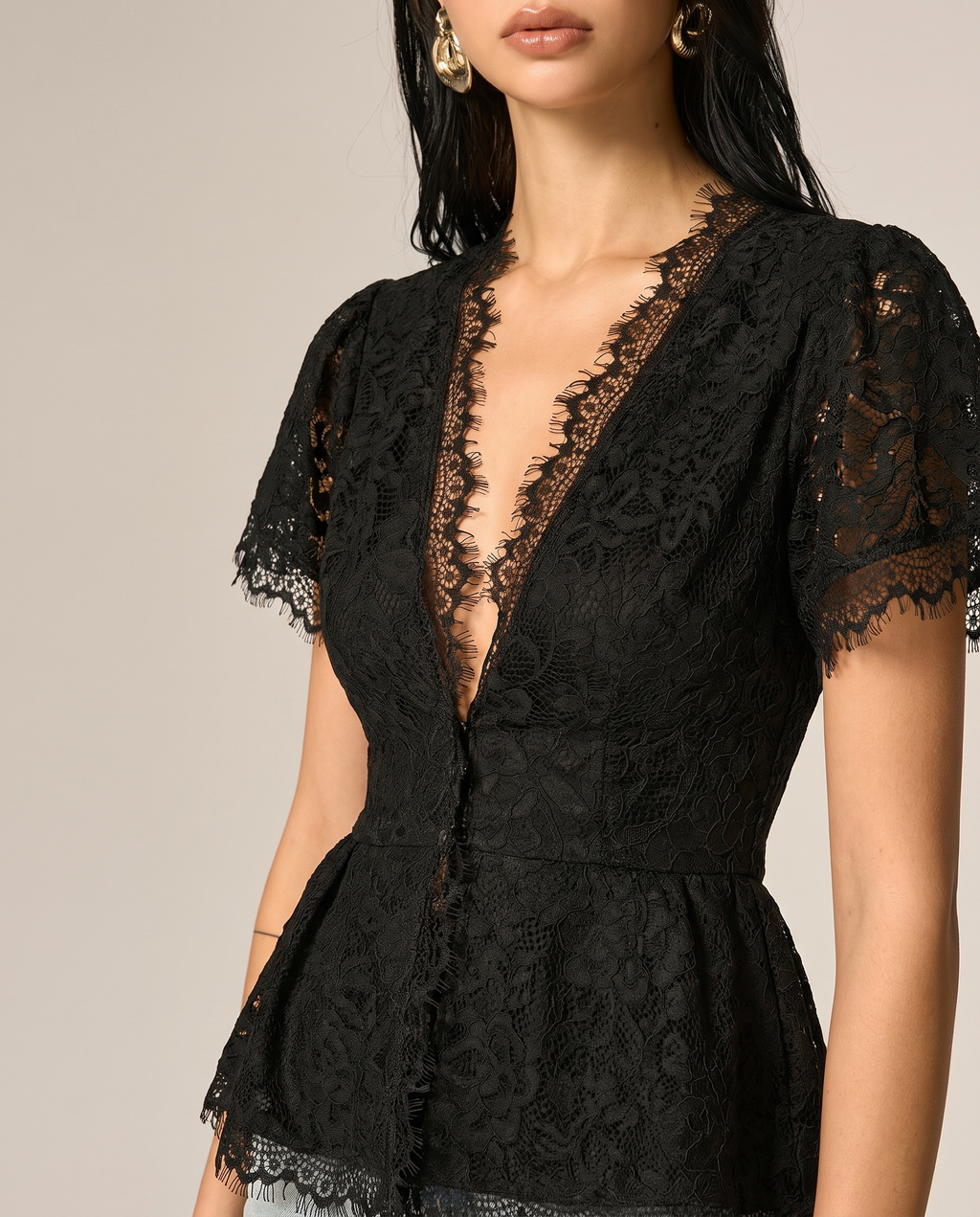 V-neckline and lace fringe detail