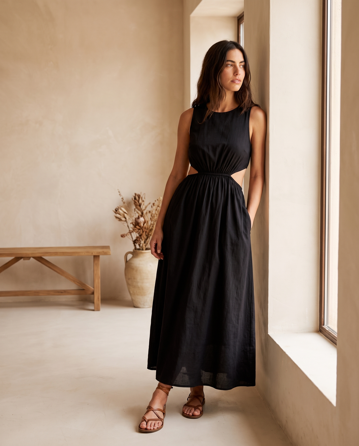 Model wearing cotton cutout sleeveless maxi dress, lifestyle