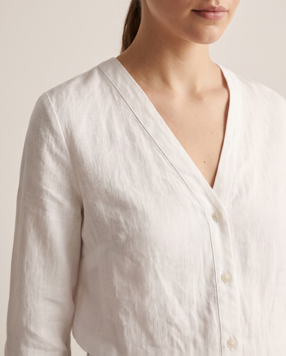 V-neck button-down blouse, neckline detail