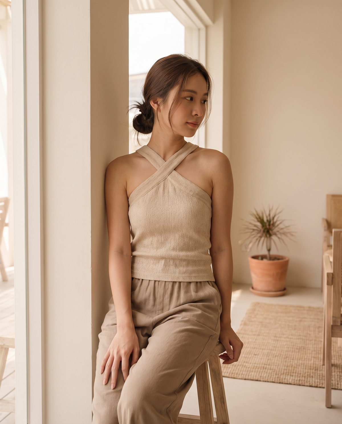 Model wearing cotton-linen crisscross halter tank top, lifestyle