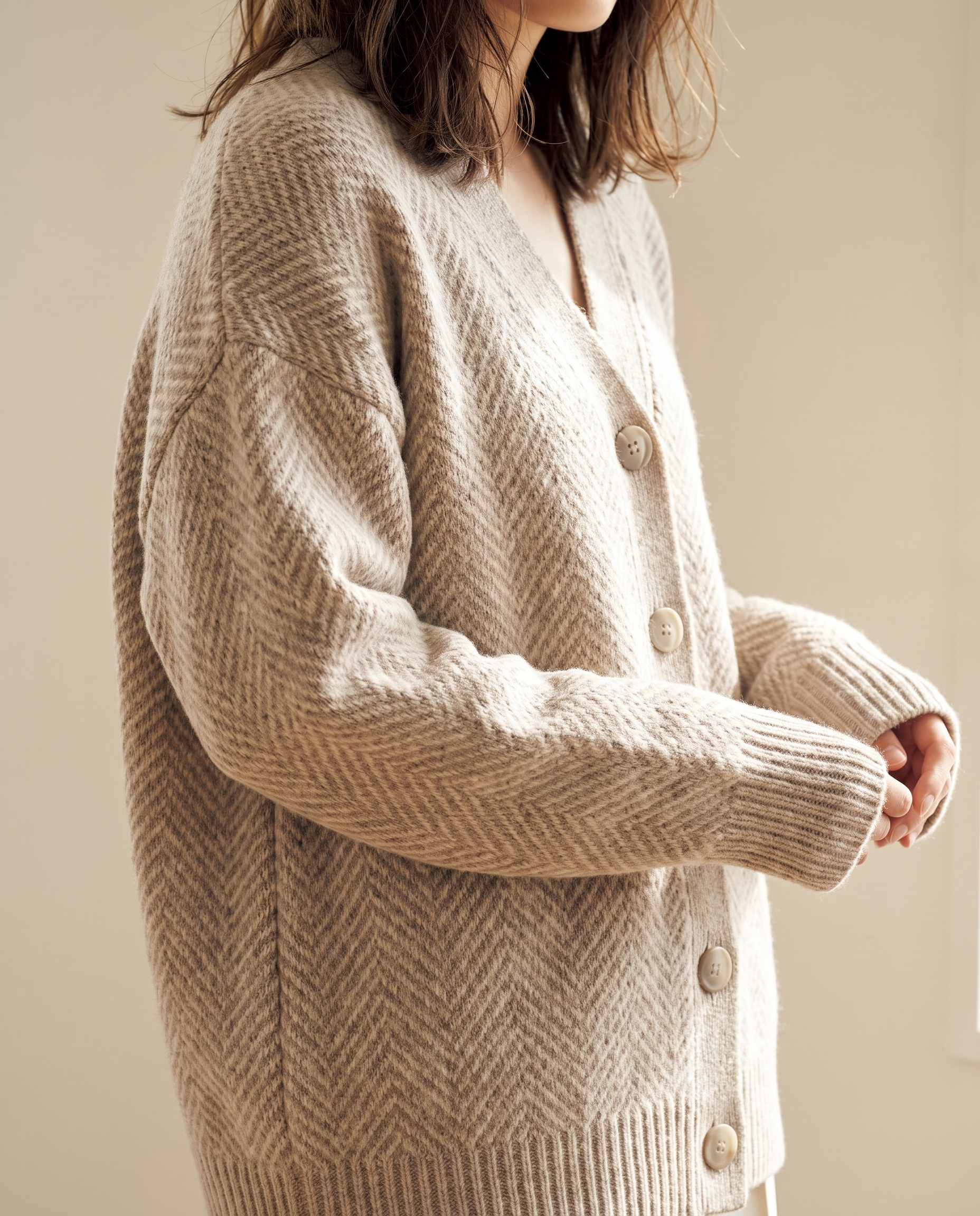 Oversized herringbone knit cardigan, knit and button detail