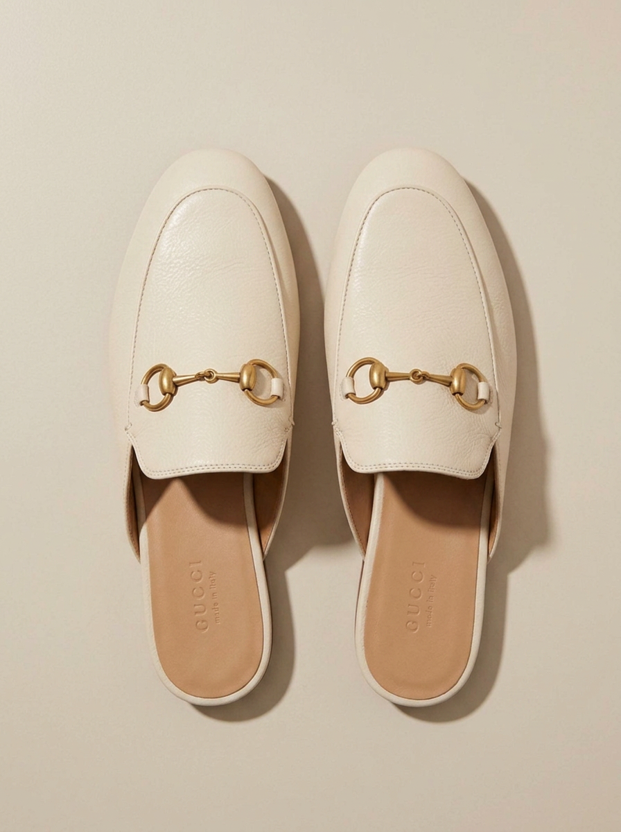 Pair of horsebit loafer mules, top-down view