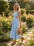 Woman wearing a blue eyelet embroidery cutout waist midi dress, front