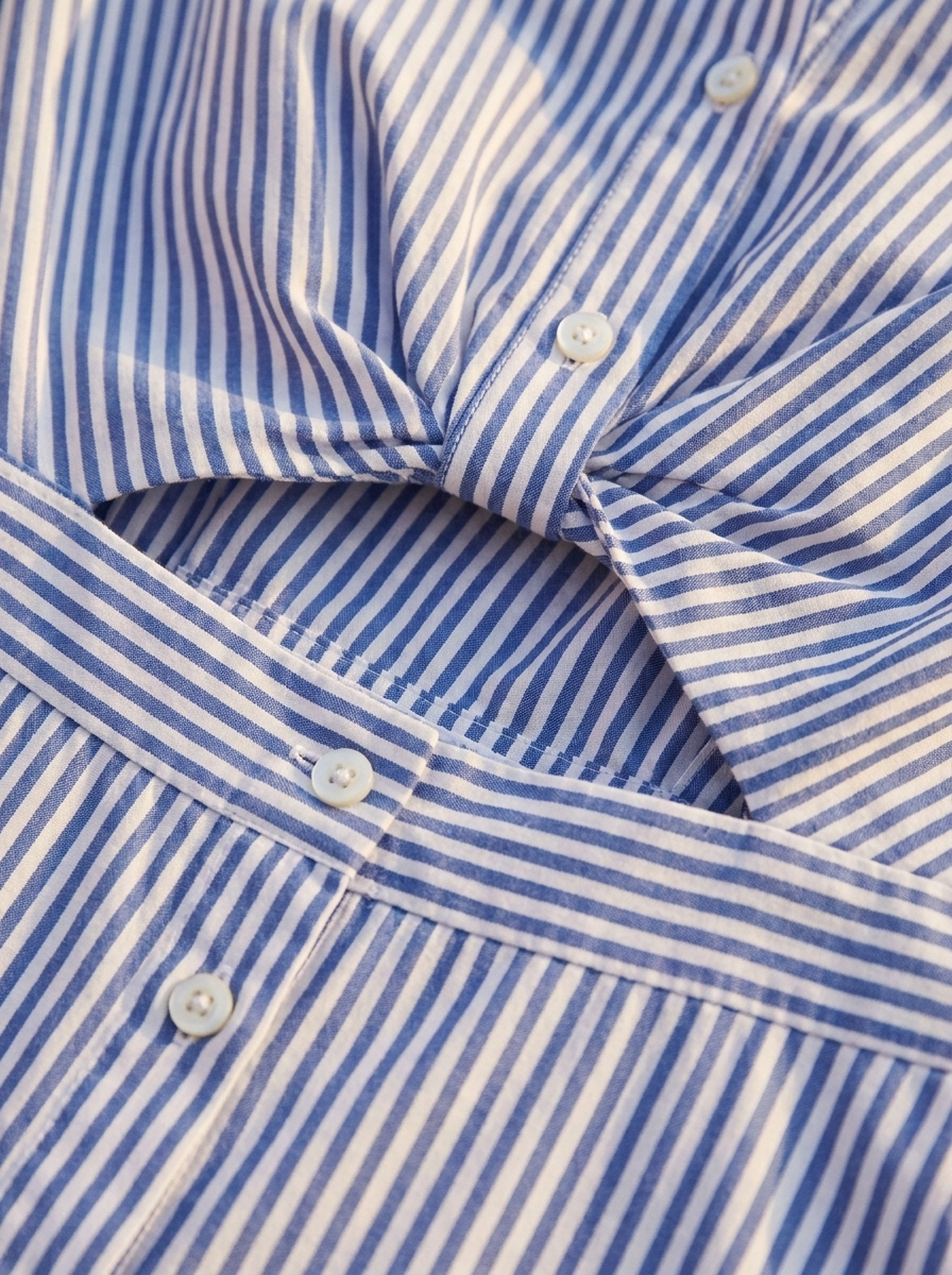 Close-up of the stripe fabric, buttons and waist cutout