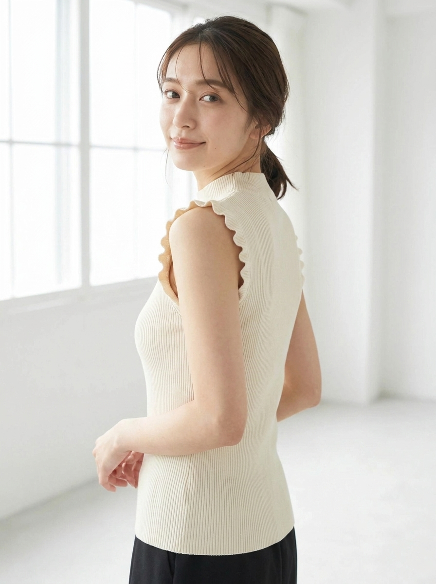 Ribbed high neck ruffle top three-quarter view