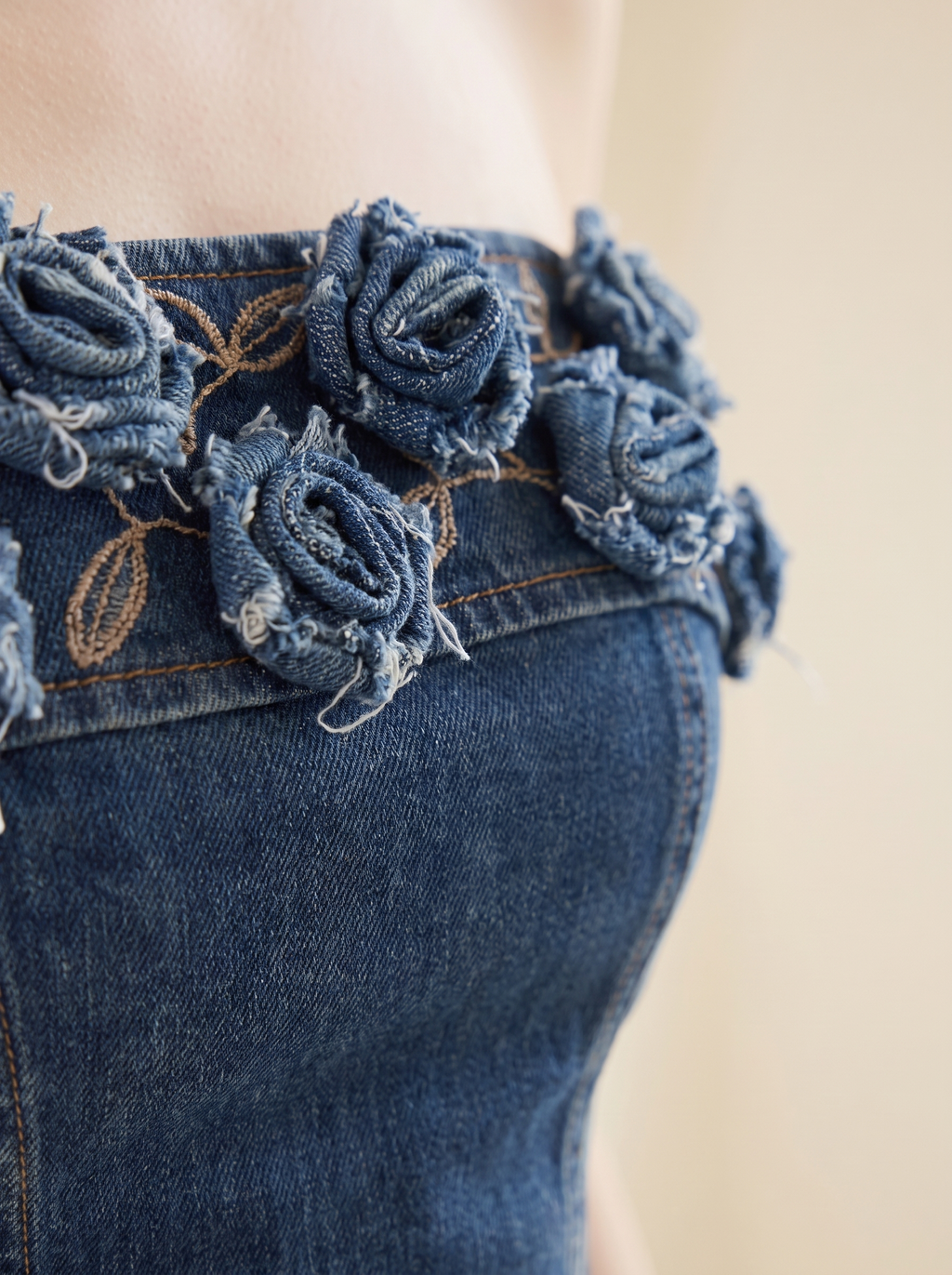 3D rose applique and denim texture detail