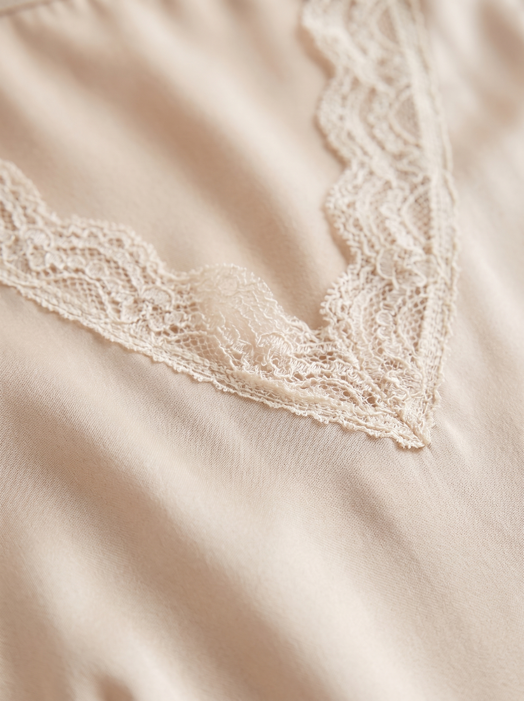 Satin fabric and lace trim detail