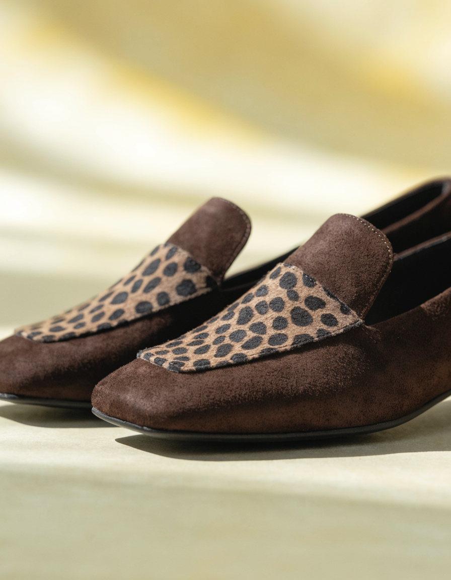 Dark brown faux suede loafers with an animal print panel and square toe