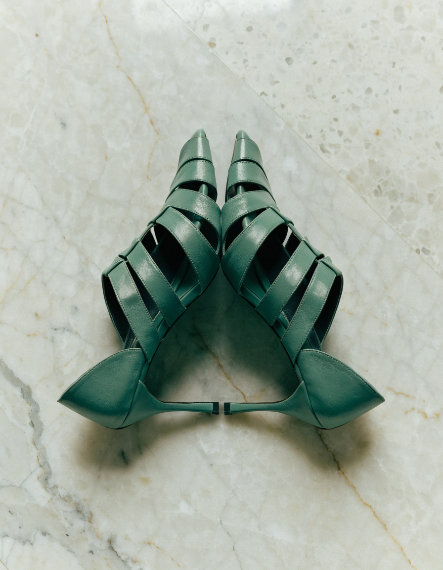 Top-down view of green multi-strap dress heels showing the strap arrangement